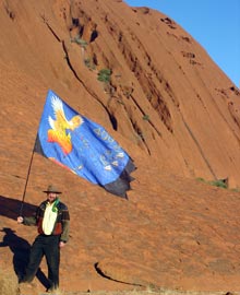 David at Ayers Rock with banner and pole